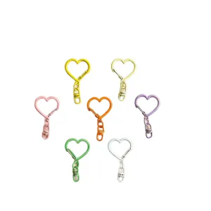 Close-up detail of colorful zinc alloy heart keychain clasps DIY accessories components.