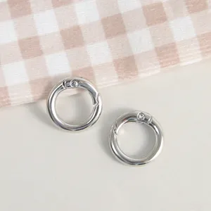 Silver metal spring rings for DIY keychains and handmade jewelry craft accessories.