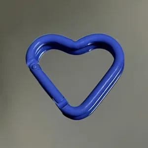 Blue heart-shaped aluminum alloy carabiner detail view, glossy finish keychain clasp accessory.