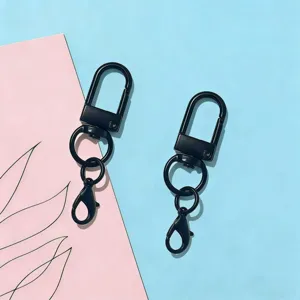 Close up of black metal U-shaped rotating key chain lobster clasp accessory, perfect for DIY crafts.