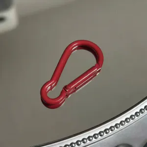 Red aluminum alloy gourd keychain detail shot, carabiner accessory for outdoor and DIY use.