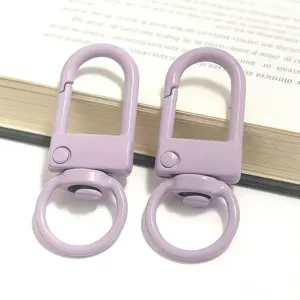 Close-up detail shot of light purple metal U-shaped snap hooks, ideal for DIY bag accessories