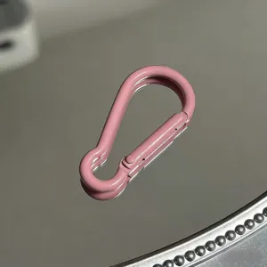 Pink aluminum alloy gourd shape carabiner detail, lightweight keychain accessory hook.