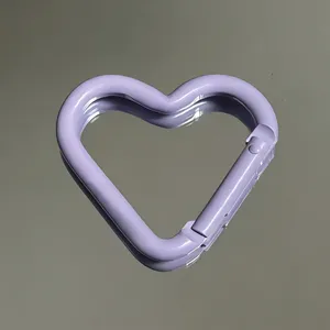 Light purple heart-shaped aluminum alloy carabiner keychain backpack hook accessory detail.