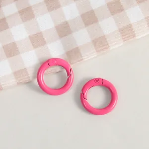 Pink metal spring rings for DIY keychains and jewelry crafts, durable alloy snap hooks.
