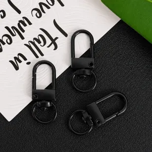 Detail view of black zinc alloy swivel snap hooks, 32mm universal keychain clasp hardware.