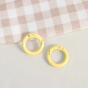 Yellow metal spring O-rings, close-up view of DIY handmade jewelry accessories and key ring findings