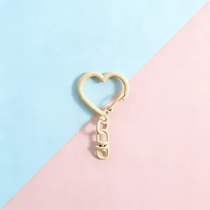 Heart-shaped alloy keychain hook DIY accessory, metal spring clasp charm for cute bags.
