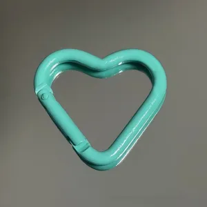 Turquoise heart shaped carabiner hook detail, glossy painted aluminum alloy keychain accessory.