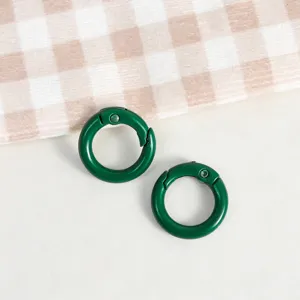 Close-up detail of green round spring rings, zinc alloy for DIY handmade accessories.