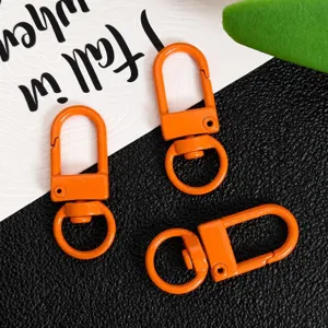 Orange metal swivel snap hooks for DIY jewelry making, bag charms, and keychain hardware accessories.