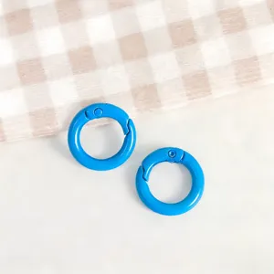 Blue zinc alloy round spring clips, detailed view of DIY handmade accessories and keyrings.