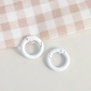 White round spring rings, metal clasps for DIY keychains and handmade jewelry crafts detail.