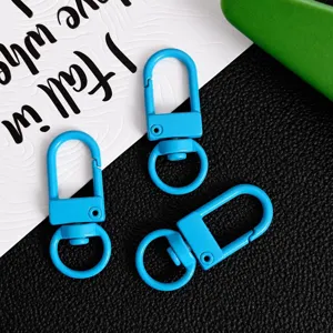 Zinc alloy swivel gate clasp detail, blue keychain hanging clip for DIY bag accessories.