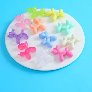 Detailed close-up view of colorful resin balloon dog charms, ideal for DIY keychain crafts.