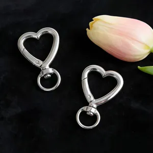 Heart shaped metal spring hook detail, silver keychain clasp for DIY luggage and bags.