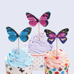 Butterfly cake toppers detail view, colorful cupcake picks for birthday party baking decoration.