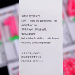 Birthday candle instruction tag detail, safety warning label for party celebration decor.