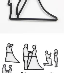 Detailed close-up view of black wedding silhouette cookie cutters and fondant molds set.