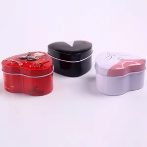 Heart-shaped metal gift boxes, wedding candy tins, romantic couple presentation details.