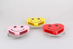 Heart shaped smiley face stainless steel pizza cutter wheel for baking and kitchen use.