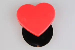 Detail view of the heart-shaped stainless steel pizza cutter wheel for easy baking and slicing.