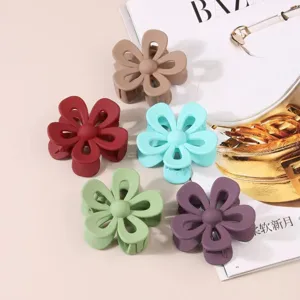 Matte acrylic hollow flower hair claw clip, vibrant colors, stylish daily hair accessory.