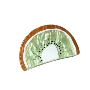 Kiwi fruit hair claw clip detail, cute resin half updo hair accessories for daily wear.