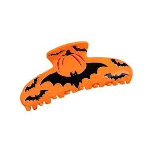 Pince à cheveux Halloween avec motif citrouille et chauve-souris, accessoire orange tendance.