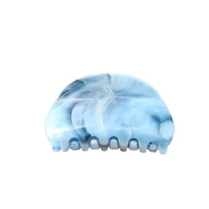 Blue marbled hair claw clip for women, stylish acrylic shark clip for daily hair styling.