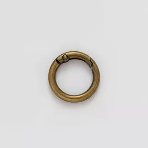 Closeup detail of antique bronze zinc alloy round spring snap hook for DIY bag keyring hardware.