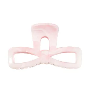 Pink marble hair claw clip detail, elegant bow design resin shark clip for women and girls.