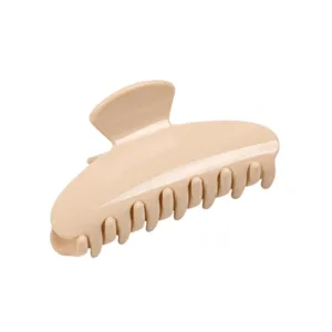 Minimalist nude beige hair claw clip detail shot, elegant daily shark hair accessory for women.