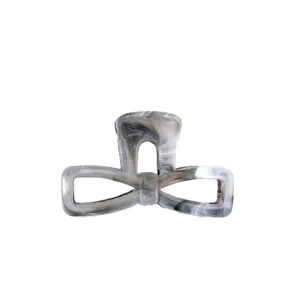 Detailed view of the elegant marble pattern bow hair claw, featuring unique geometric cutout style.