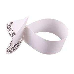 White paper lace wrapper for gift chocolate and cupcake decoration, elegant hollow design.