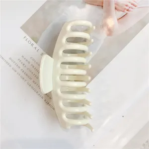 Minimalist ivory white plastic hair claw clip, sturdy shark teeth for secure hold daily styling.