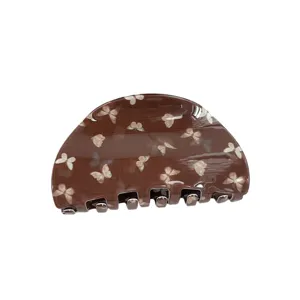 Molla per capelli a semicerchio marrone con stampa di farfalle, stile retrò chic.