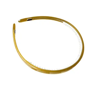 Cerchietto per capelli in acetato marrone con denti interni bianchi, fascia elegante e semplice.