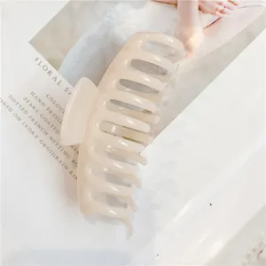 Minimalist beige acrylic hair claw clip detail shot, glossy finish for daily elegant hair styling.