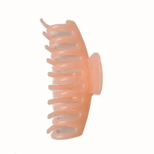 Pink jelly hair claw clip with shark teeth for women, translucent daily styling hair accessory.