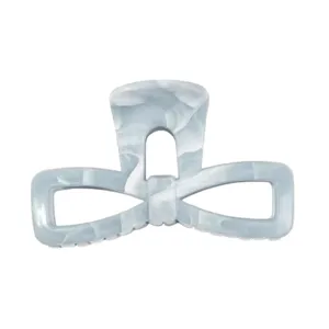 Detailed view of a light blue marble pattern bow hair claw, elegant vintage shark clip.
