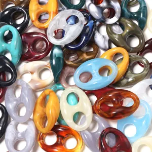 Assorted colorful marbled acrylic chain links, ideal for DIY handmade bracelets and accessories.