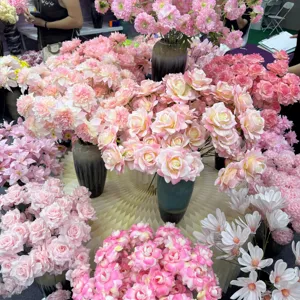 Stunning artificial pink roses and chrysanthemums bouquet for wedding party floral decoration.