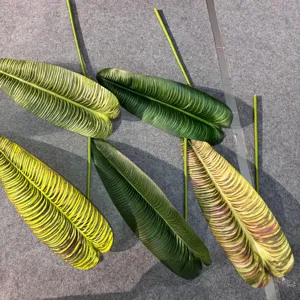 Artificial plant leaves detail shot, showing realistic texture and multiple color variations.