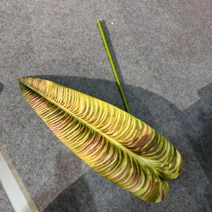 Artificial tropical plant leaf detail close-up for home wall decor floral design.