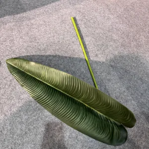Closeup detail of artificial banana leaf decor, realistic vein pattern for home decor.