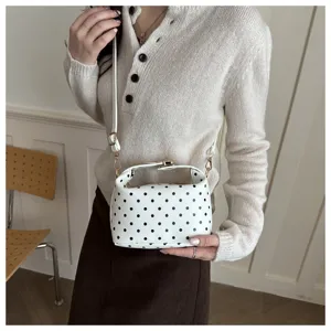 White polka dot cosmetic bag detail, versatile shoulder handbag for women, large capacity.