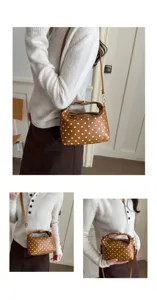 Brown polka dot cosmetic bag detail view, large capacity portable storage handbag for women.