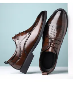 Detail shot of the dark brown leather formal dress shoes with stylish perforated patterns.