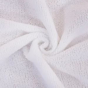 Close-up detail of white microfiber cleaning cloth showcasing soft texture and absorbent fabric.